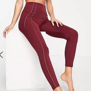 Nike Yoga Dri-FIT Lurex tape 7/8 high waisted leggings in burgundy